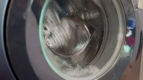 Fully automatic front-loading washing machine with anti-tangle technology Vídeos de archivo 306778929