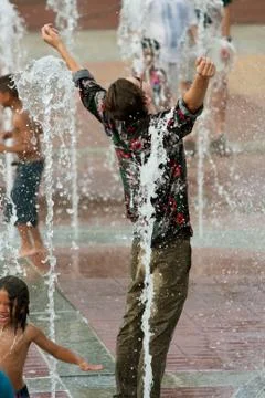 Fully Clothed Man Gets Triumphantly Soaked In Atlanta Fountain Stock Photos