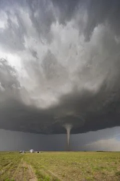 Fully Condensed Tornado, a rotating column of air reaching to the ground, a.. Stock Photos