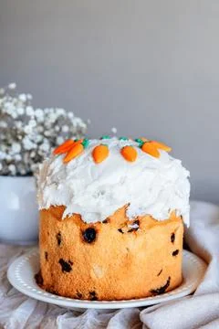 Fully decorated homemade Easter cake placed tablecloth. 스톡 사진