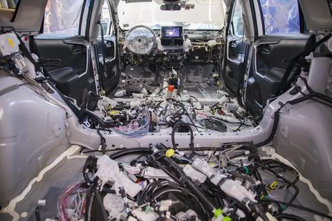 A fully disassembled car interior during wiring replacement Stock Photos