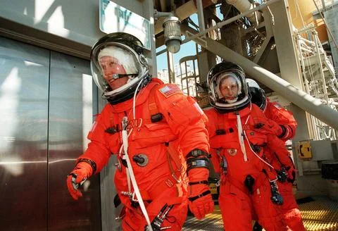 Fully dressed in their launch and entry suits, STS-98 Mission Specialists ... Photos