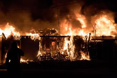 Fully engulfed house fire. Stock Photos