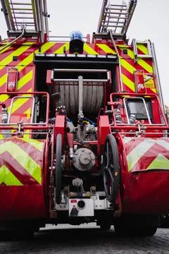 Fully Equipped Back of a Large Fire Truck with Water Hoses Extinguishing Eq.. Stock Photos