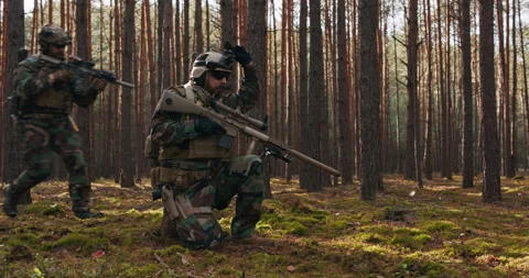 Fully Equipped Middle - Aged Soldiers Wearing Camouflage Uniform Attacking Enemy Stock Footage 144229232