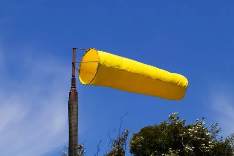 Fully Erect Bright Yellow Wind Indication Sock Stock Photos