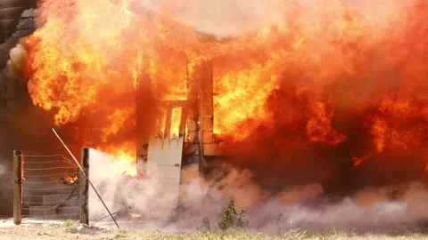 Fully Ingulfed Home with Fireman 動画素材 197444115