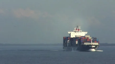 A fully laden container ship turning to starboard. Stock Footage 8549581