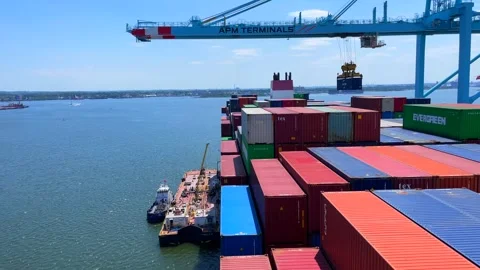 Fully loaded ultra large container vessel has cargo operations by gantry crane Stock Footage 242828054