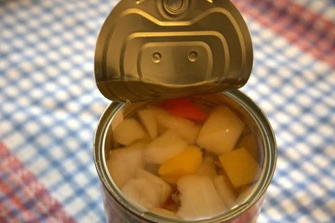 Fully opened fruit salad can with copy space Fotos Stock