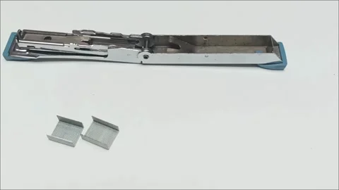 Fully opened metallic stapler with two rows of pins Stock Footage 338140584