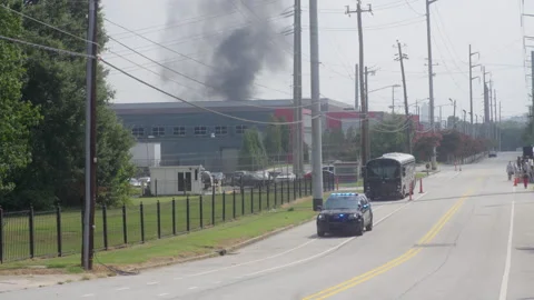 Fulton County Sheriff driving with smoke in background 動画素材 276234074
