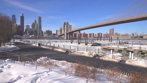 Fulton Ferry Landing is wrapped up by thousands of Ice floes at Brooklyn Bridge. Stock Footage 337079445