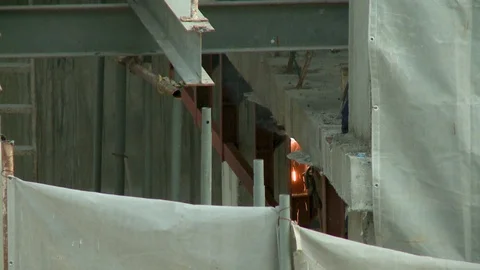 Fumes from welding in a building construction site Video stock 120010322