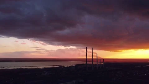 Fuming chimneys of a power plant backdrop of a sky in the evening Stock Footage 154097616