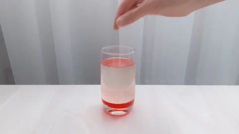 Fun and easy science and experiment for kids. Oil and water don't mix. Stock Footage 139134806