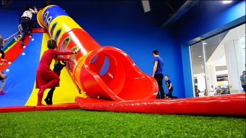 Fun and expanse of the children's high hill in the complex of attractions Stock Footage 76684730