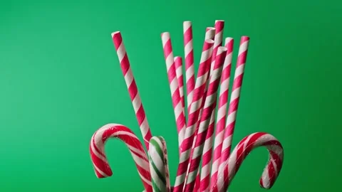 Fun with candy canes and striped straws for New Year and Christmas celebrations Stock Footage 338406309