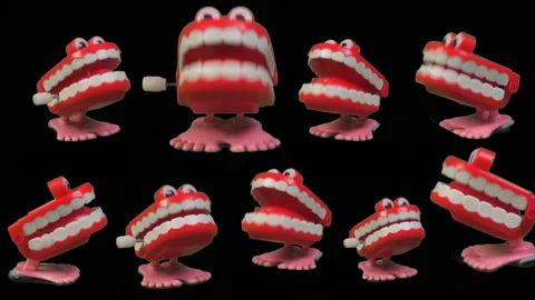 A fun collection of toy chattering teeth. Chatty joke. Stock Footage 235924259