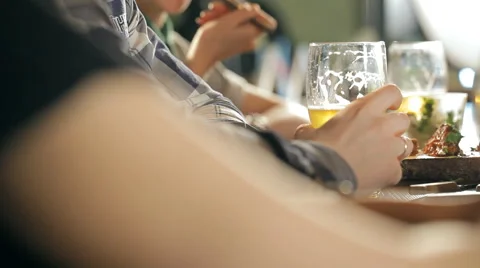 A fun company is drinking beer at the bar Video stock 62995665