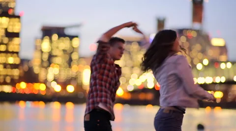Fun Couple Walk On Dock, Man Twirls His Girlfriend, They Walk Past Camera Stock Footage 61042946