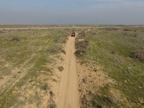 Fun Cruiser rides through the desert and along the steppe race of the rally Stock Footage 74577831