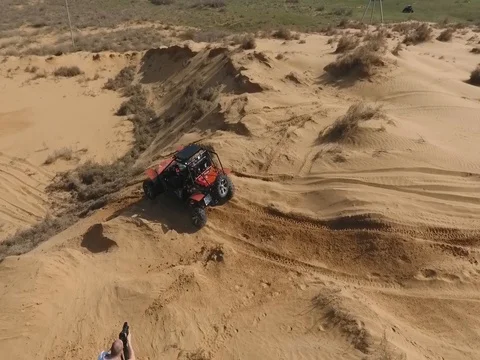 Fun Cruiser rides through the desert and along the steppe race of the rally Stock Footage 74578393