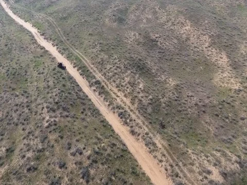 Fun Cruiser rides through the desert and along the steppe race of the rally Stock Footage 74578631
