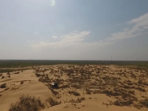 Fun Cruiser rides through the desert and along the steppe race of the rally Stock Footage 74578920