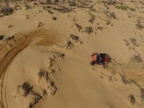 Fun Cruiser rides through the desert and along the steppe race of the rally Stock Footage 74579034