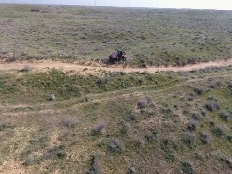 Fun Cruiser rides through the desert and along the steppe race of the rally Stock Footage 74579275