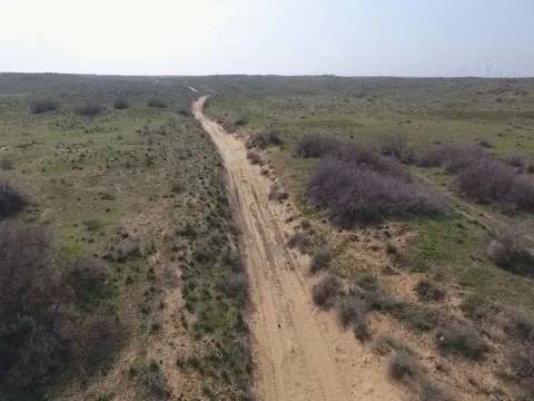 Fun Cruiser rides through the desert and along the steppe race of the rally Stock Footage 74579291