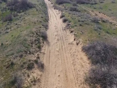 Fun Cruiser rides through the desert and along the steppe race of the rally Stock Footage 74579343