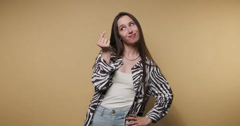 Fun dance expressions and playful actions in studio setting with yellow bac.. Stock Footage 317397347
