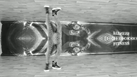 Fun Dancer Performs Acrobatic Dance On Front Of Camera In Black White Stock Footage 85194331