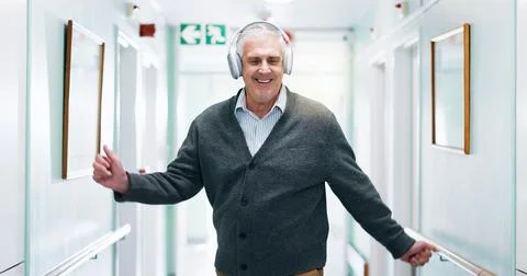 Fun, dancing or old man in center with headphones, music streaming or listening Stock Photos