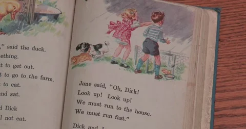 Fun with Dick and Jane book - Learning to read - Open Book Stock Footage 257830083