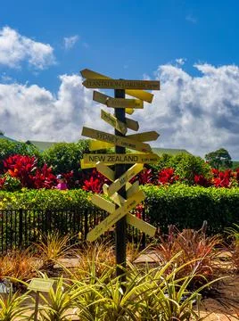 Fun directional sign post with countries of the pacific region Stock Photos