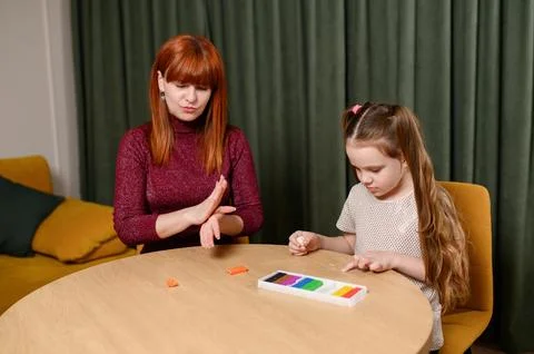 Fun educational activity to develop creative and motor skills. Mother and Stock Photos