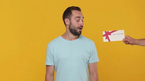 Fun excited young man 20s in basic casual blue t-shirt isolated on yellow Video stock 148291438