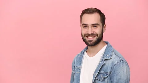 Fun expressive young man guy 20s years old in denim jacket white t-shirt Stock Footage 136323969