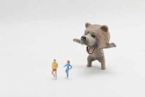 A fun of figure world with bear attack Stock Photos