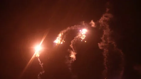 Fun Fireworks in the Sky Glow One By One, Slow Motion Stock Footage 170377471