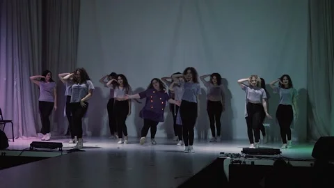Fun full girl dancing on stage with other girls Stock Footage 130751283