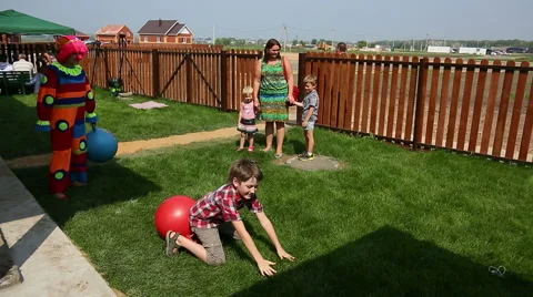 Fun games, jumping on an inflatable rubber ball Stock Footage 44478690