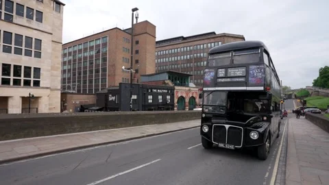 A fun ghost tour spooky black bus on the streets of York with a smiling driver Stock Footage 276096900