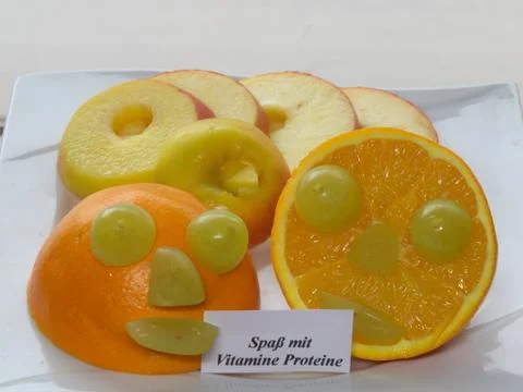 Fun with grape at orange Stock Photos