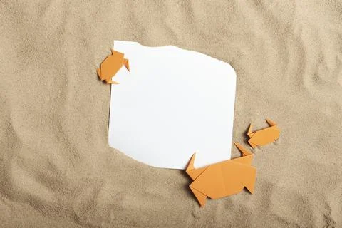 Fun layout, sand background, paper crabs and blank card: summer, beach, vacat Stock Photos
