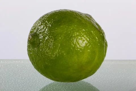 Fun Lime on Plain Background with Reflection Stock Photos