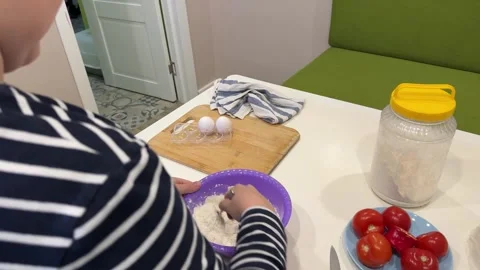 A fun-loving boy learns to make pizza, experimenting with toppings Stock Footage 302917690